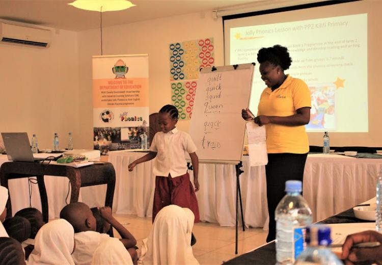 LEARNING THROUGH SOUNDS: Jackline Karisa of Kilifi Primary School demonstrates with her PP2 pupils how the Jolly Phonics works during the Jolly Symposium last year on October 14 in Kilifi.